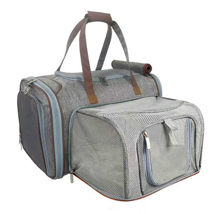 Gray pet carrier with brown handles on a white background